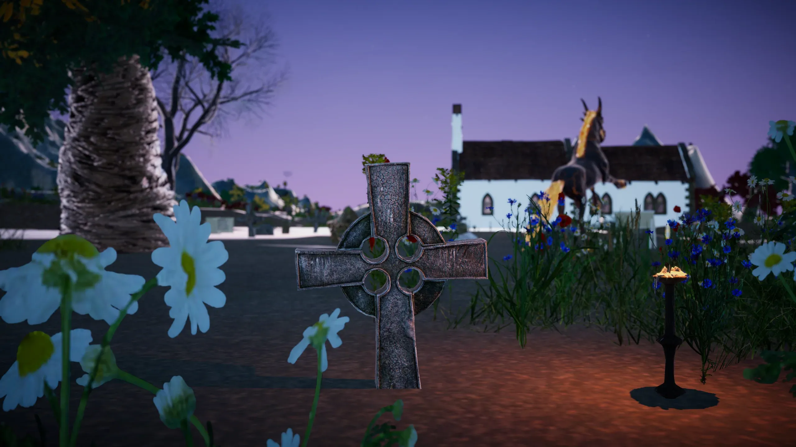 A stone cross among wildflowers in front of a village chapel at dusk.